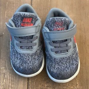 Size 7, gray and red Nike shoes